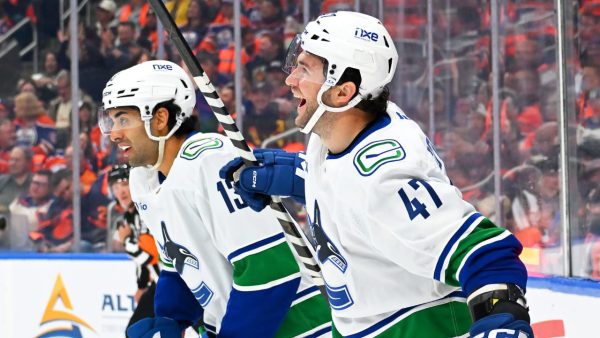 Canucks recover for OT victory against Oilers after blowing three-goal lead