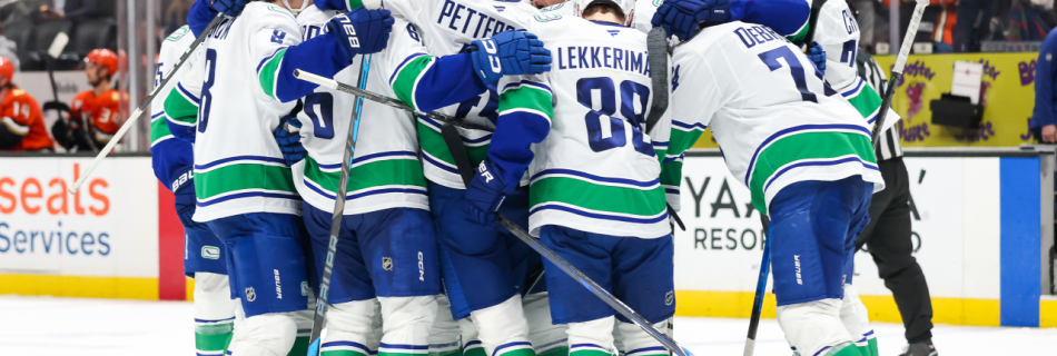 Canucks rally with three goals late, top Ducks in OT to end slide at 10