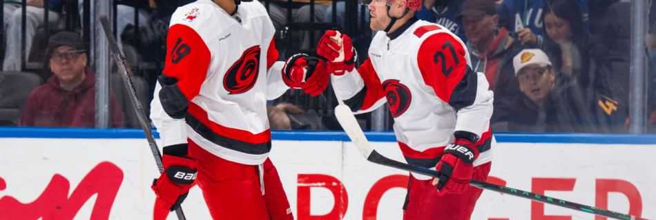Hurricanes score six, pull away from slumping Canucks