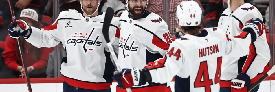 Tuch scores twice in debut, Capitals cruise past Hurricanes