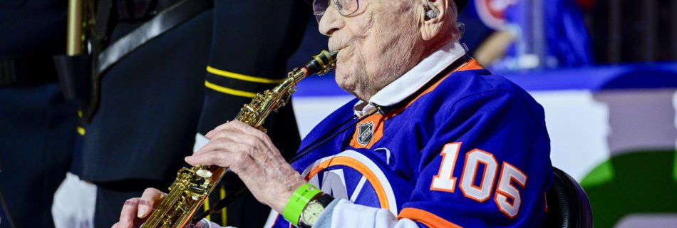 WWII veteran plays national anthem