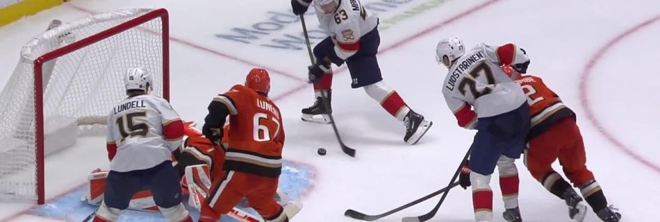 Marchand ties it late