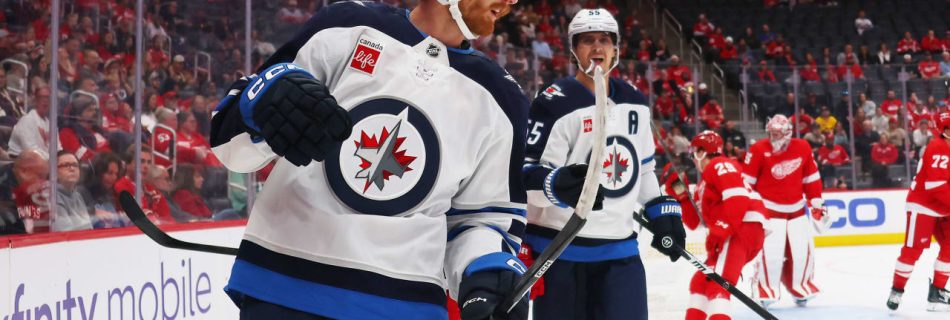 Connor scores twice on power play, Jets edge Red Wings for first win of season