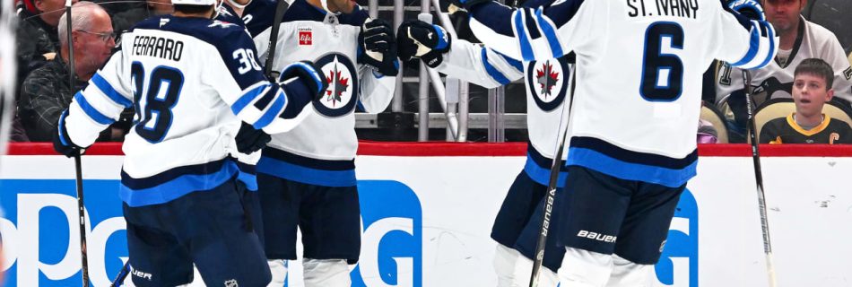 Jets surge with three goals in third period, hand Penguins first loss