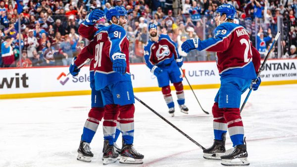 Avalanche score four in third, surge past Devils