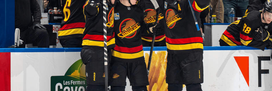 Canucks rally in third period, score four in comeback against Flames